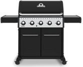 Broil King CROWN 520 professional-grade gas grill with five control knobs, black finish, side shelves, and storage cabinet.