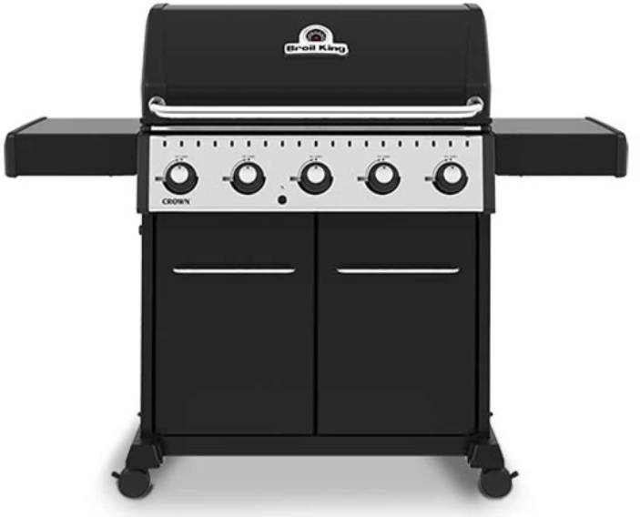 Broil King CROWN 520 professional-grade gas grill with five control knobs, black finish, side shelves, and storage cabinet.