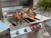 KoKoMo BBQ grill with rotisserie kit roasting two whole chickens on stainless steel spit rod