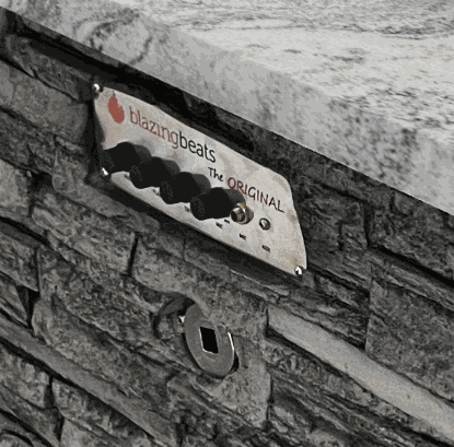 Blazing Beats Fire table control panel on stone base with granite top