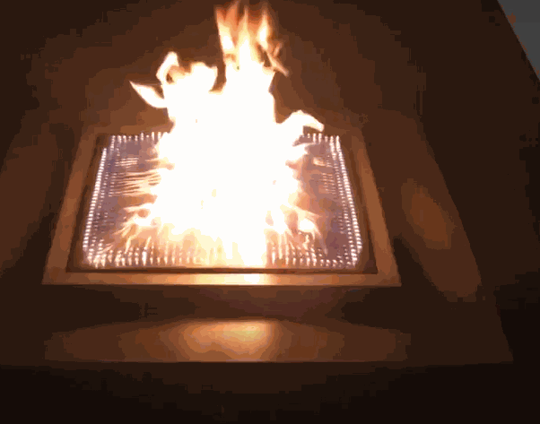 Blazing Beats Fire table with sound-driven fire burner and granite top glowing with flames